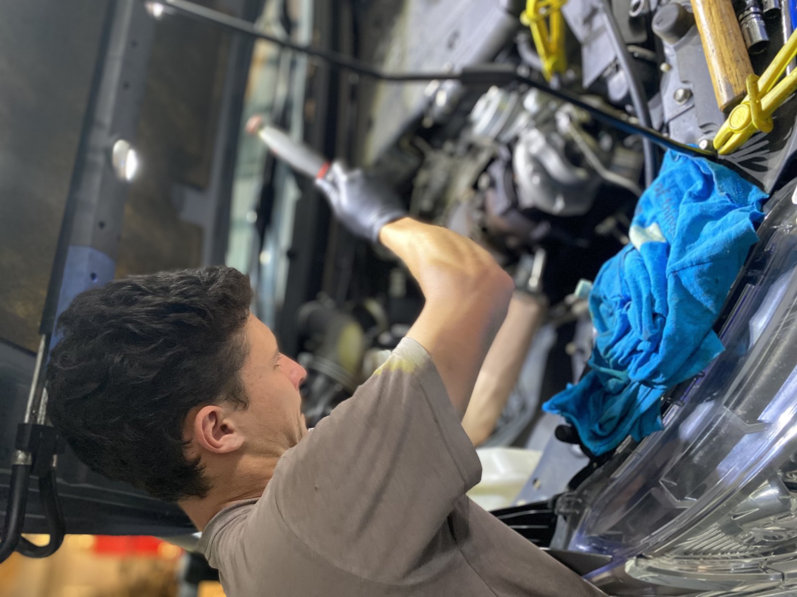 Dylan from Prestige Performance Mechanical working on a vehicle as a mobile mechanic